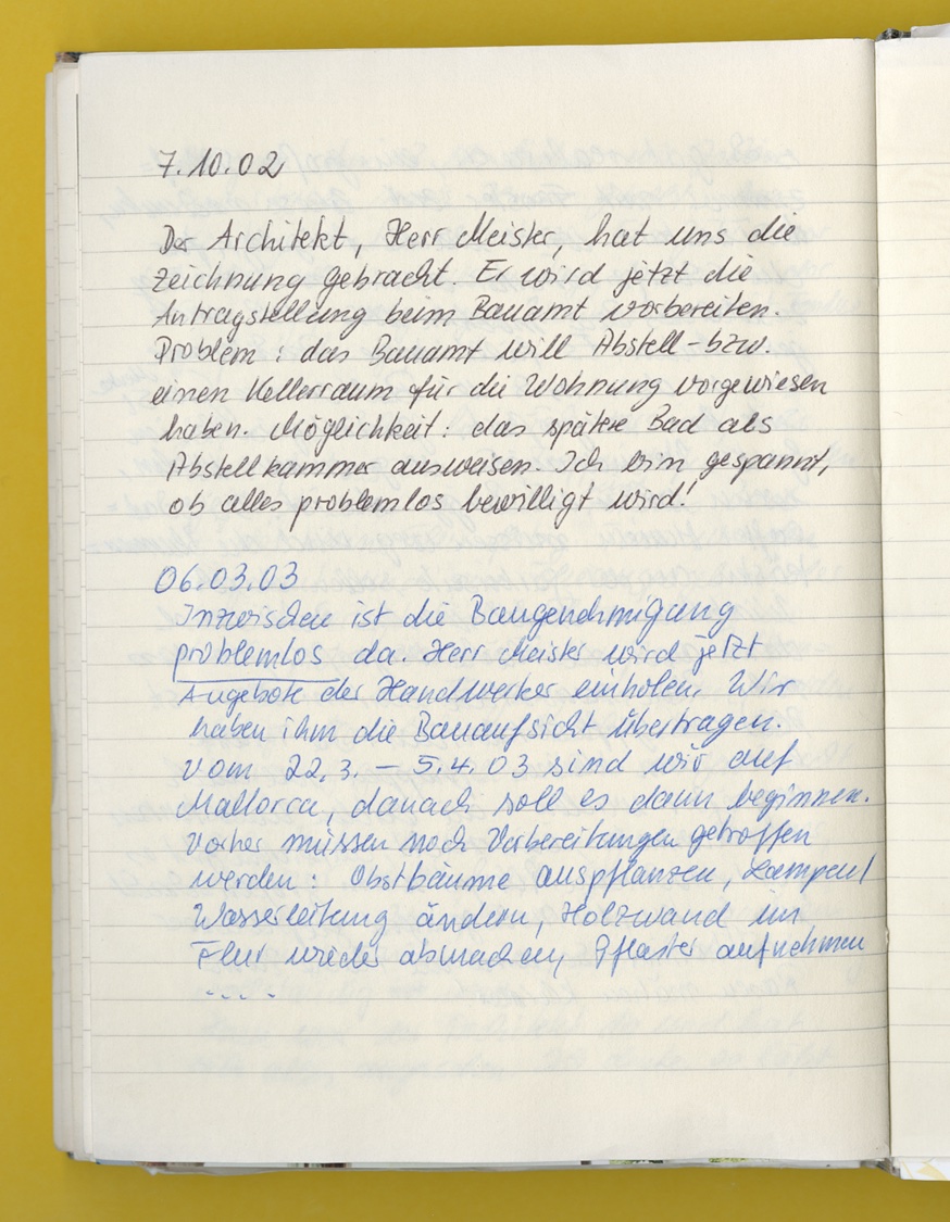 Photo: A page from a notebook with an entry about new construction work in 2002.
