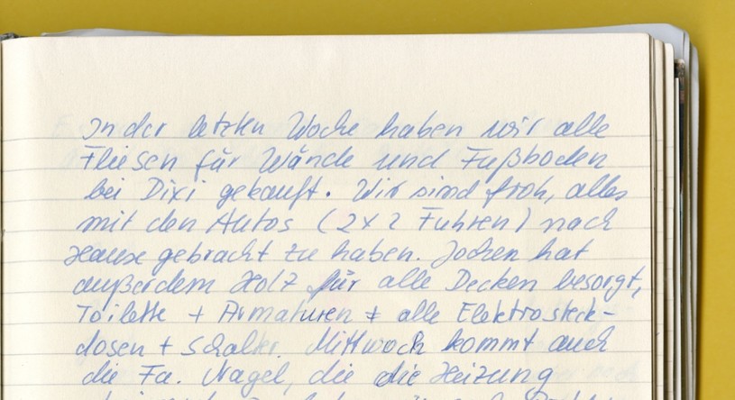 Photo: A page from a notebook with entry documenting the process of building the house.