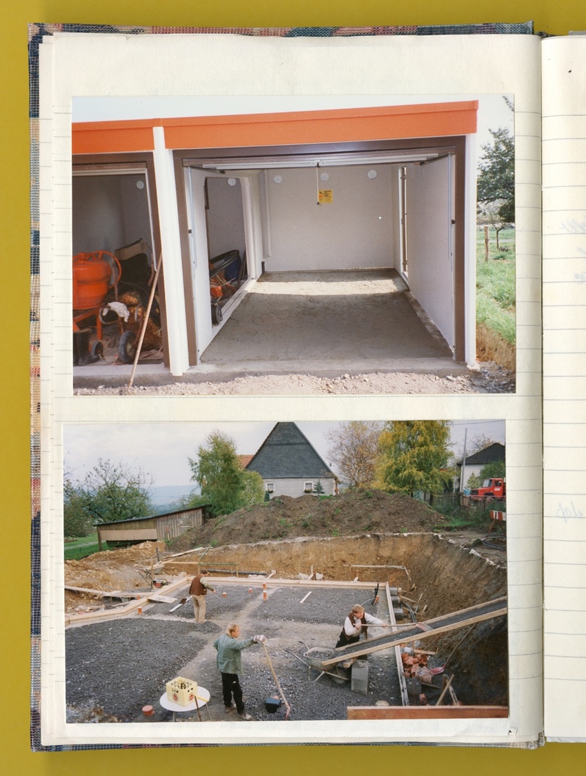Photo: A page from a notebook with photos of the garage installation and foundation work..