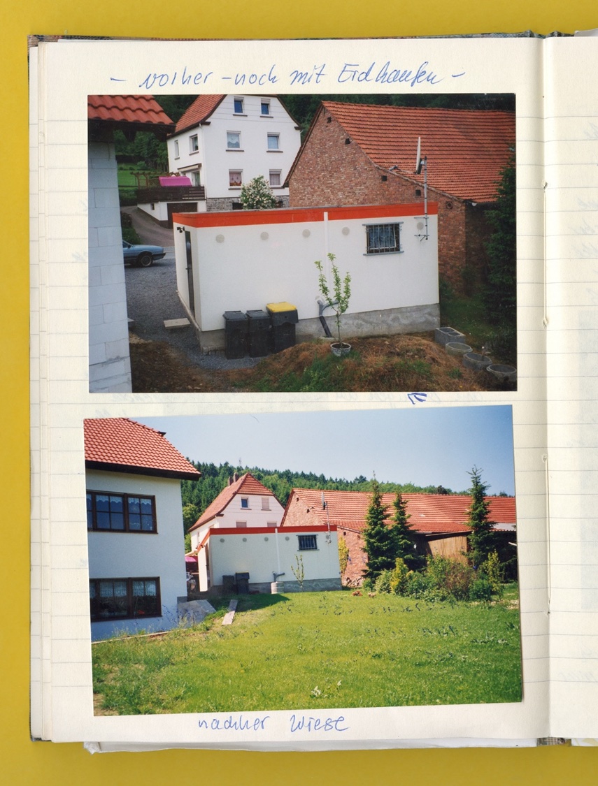 Photo: A page from a notebook showing photos taken before and after the garage installation.